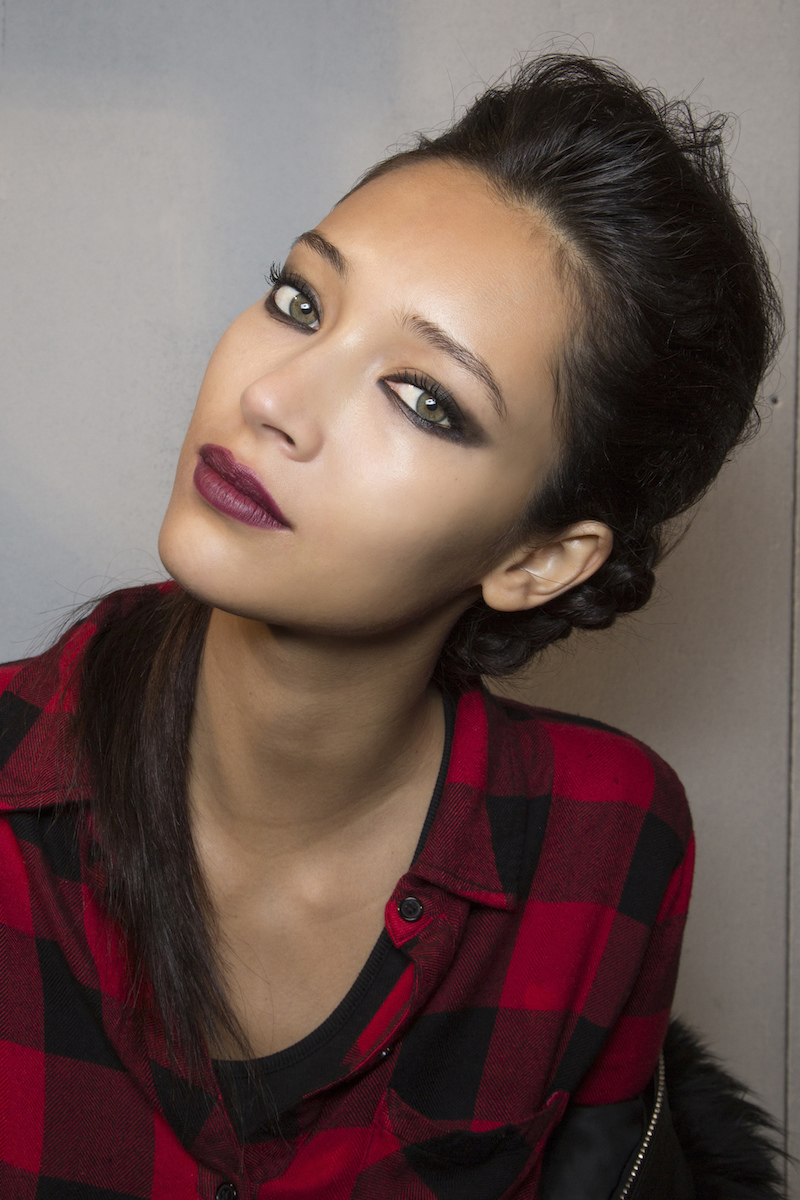 model with berry lipstick