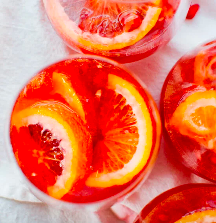 STYLECASTER | 11 Champagne Punch Recipes That'll Make Any Party More Fun | Blood Orange Pomegranate Sparkling Sangria