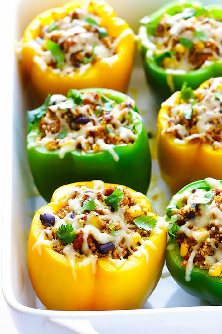 STYLECASTER | 17 High-Protein Summer Dinners With 5 Ingredients or Less | Mexican Quinoa Stuffed Peppers
