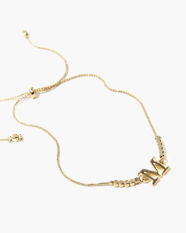 STYLECASTER | Word and Name Jewelry Is Having a Moment, Because Carrie Bradshaw Is a Forever Fashion Icon