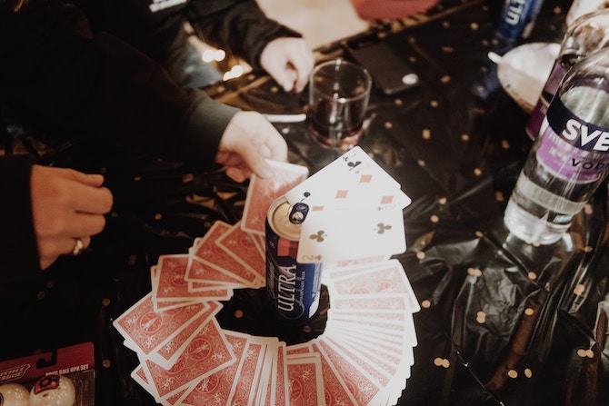 A table covered with cards and alcohol