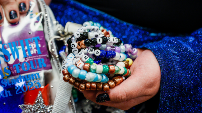 Taylor Swift fan showing friendship braclets at Eras Tour.