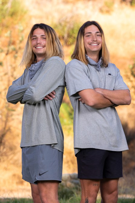 Anthony and Bailey Smith, two blonde men wearing matching grey athletic wear.