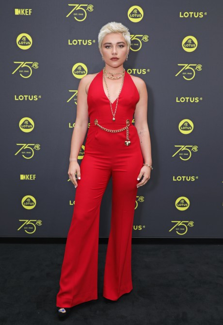 Florence Pugh in a retro red jumpsuit at the launch of Lotus London in July 2023