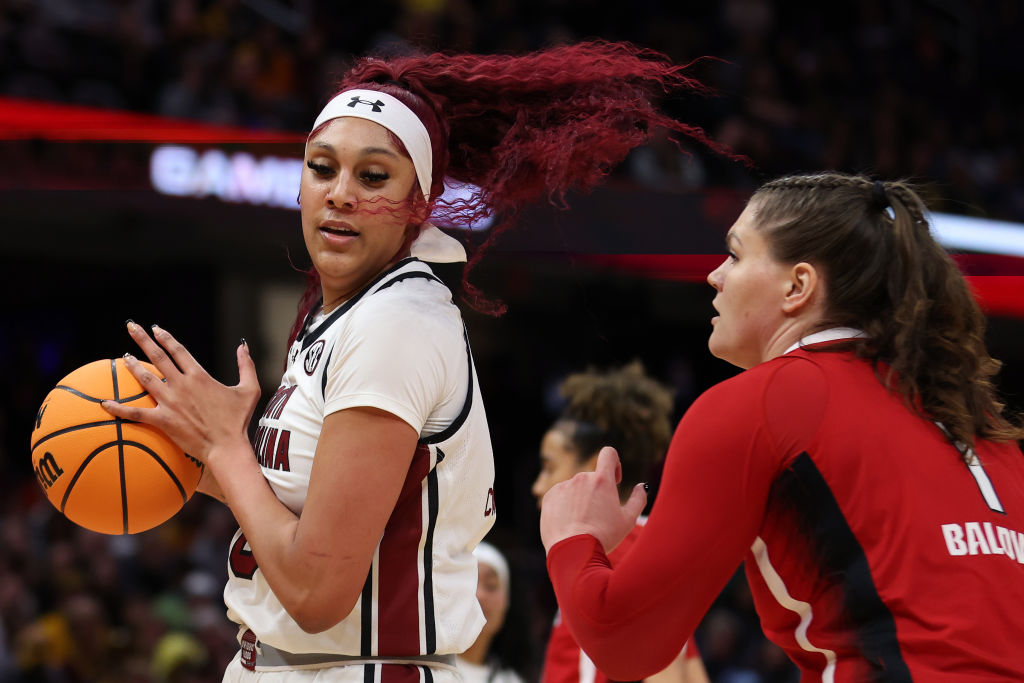 Kamilla Cardoso #10 of the South Carolina Gamecocks works around River Baldwin #1 of the NC State Wolfpack in the first half during the NCAA Women's Basketball Tournament Final Four semifinal game at Rocket Mortgage Fieldhouse on April 05, 2024 in Cleveland, Ohio.