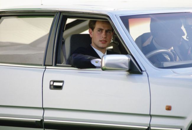Prince Edward, Earl of Wessex drives a Rover car in the grounds at Windsor