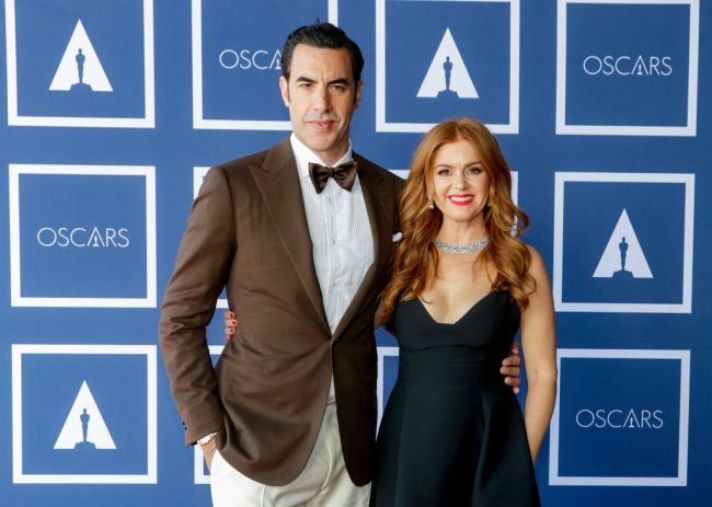 Sacha Baron Cohen (L) and Isla Fisher attend a screening of the Oscars on Monday, April 26, 2021 in Sydney, Australia.
