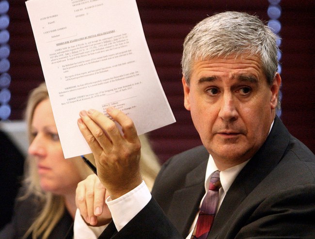 Jeff Ashton, right, Assistant State Attorney, holds a document to show defense attorney Jose Baez Friday, April 8, 2011, during Casey Anthony's pre-trial hearing at the Orange County courthouse in Orlando, Florida. Anthony, 25, is accused of killing 2-year-old daughter Caylee Marie Anthony in 2008.