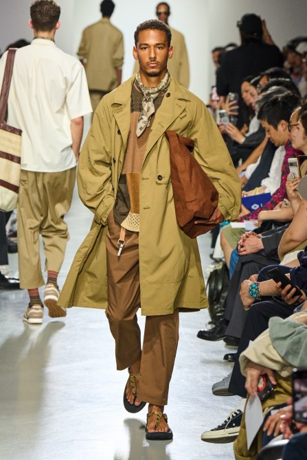 A model wearing a trench coat.
