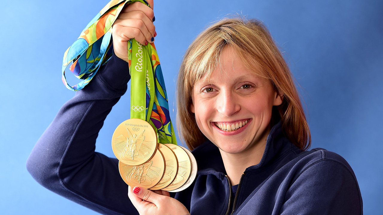 RIO DE JANEIRO, BRAZIL - AUGUST 13:  (BROADCAST - OUT) Swimmer, Katie Ledecky of the United States poses for a photo with her five medals on the Today show set on Copacabana Beach on August 13, 2016 in Rio de Janeiro, Brazil