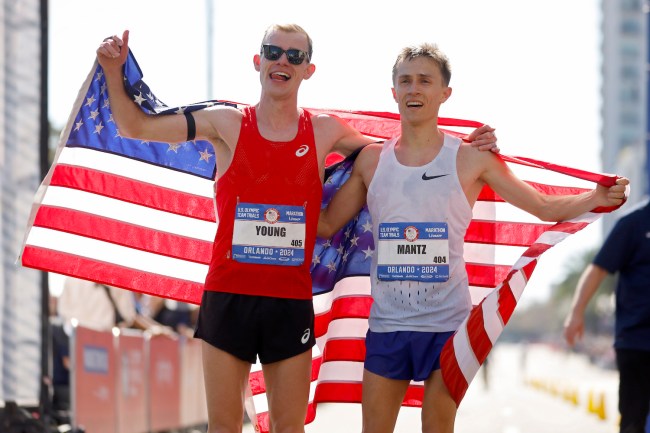 Clayton Young (L) and Conner Mantz celebrate after placing second and first during the 2024 U.S. Olympic Team Trials - Marathon on February 03, 2024 in Orlando, Florida.