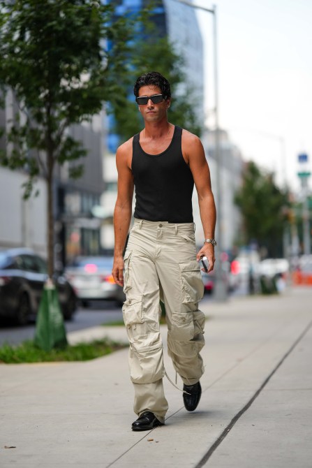 STYLECASTER | Minimalist Outfits for Men, cargo pants and black tank top