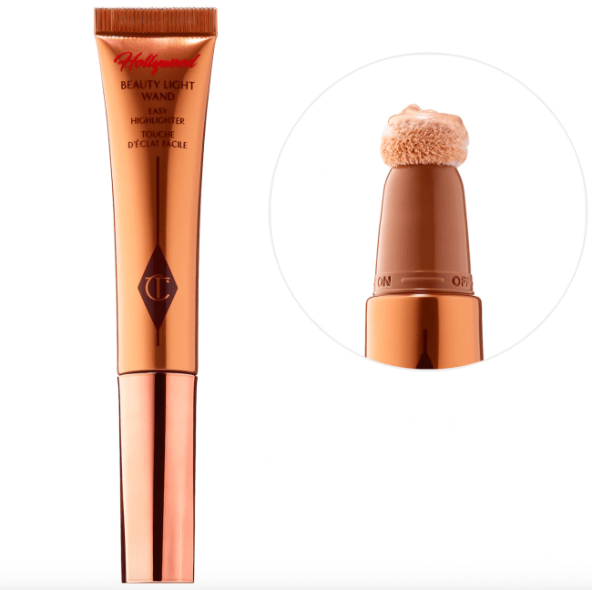 Charlotte Tilbury Beauty Highlighter Wand in Spotlight in a gold tube.