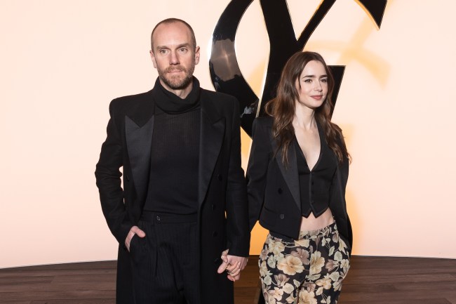 Charlie McDowell and Lily Collins attend the Saint Laurent Womenswear Fall/Winter 2024-2025 show as part of Paris Fashion Week on February 27, 2024 in Paris, France.