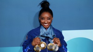 Simone Biles of Team United States poses with her Paris 2024 Olympic medals following the Artistic Gymnastics Women's Floor Exercise Final on day ten of the Olympic Games Paris 2024 at Bercy Arena on August 05, 2024 in Paris, France
