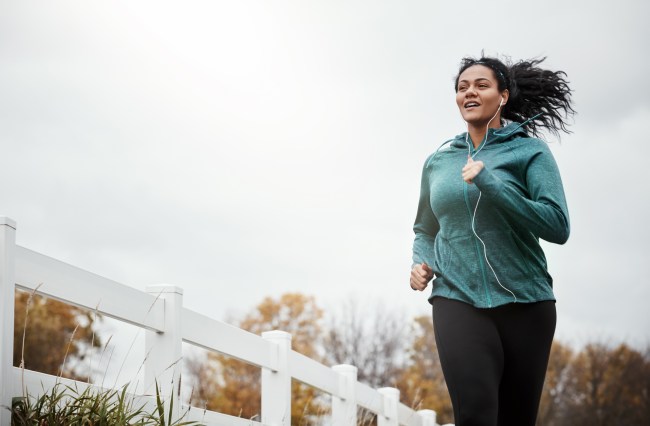 Shot of a young woman going for a run in nature