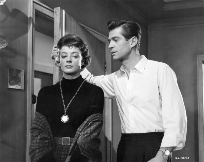 1958:  Maggie Smith and George Nader star in the Ealing Studios film 'Nowhere To Go'.