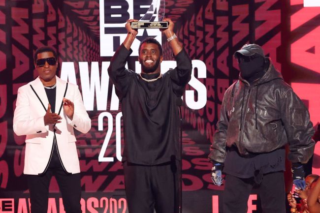 Honoree Sean ‘Diddy’ Combs (C) accepts the BET Lifetime Achievement Award from Babyface (L) and Kanye West (R) onstage during the 2022 BET Awards at Microsoft Theater on June 26, 2022 in Los Angeles, California.