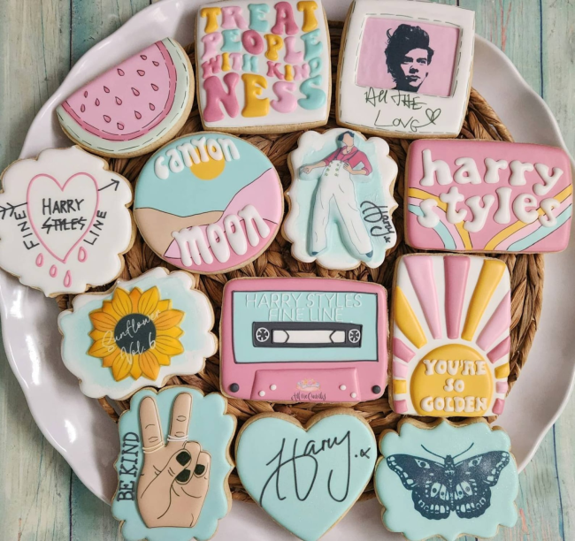 A plate of colorful Harry Styles cookies