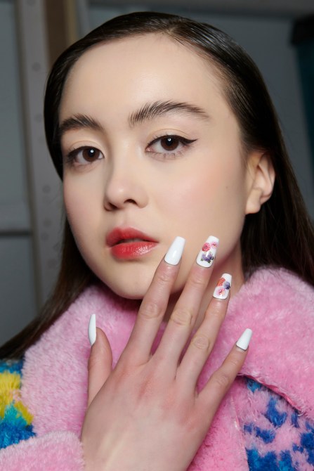 A model with floral nails.