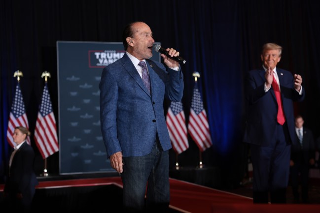 CONCORD, NORTH CAROLINA - OCTOBER 21: American country music singer-songwriter Lee Greenwood sings alongside Republican presidential nominee, former U.S. President Donald Trump, during the “11th Hour Family Leaders Meeting” at the Concord Convention Center in Concord, North Carolina on October 21, 2024. Trump is campaigning throughout North Carolina today as he and Democratic presidential nominee, U.S. Vice President Kamala Harris continue to campaign in battleground swing states ahead of the November 5th election.
