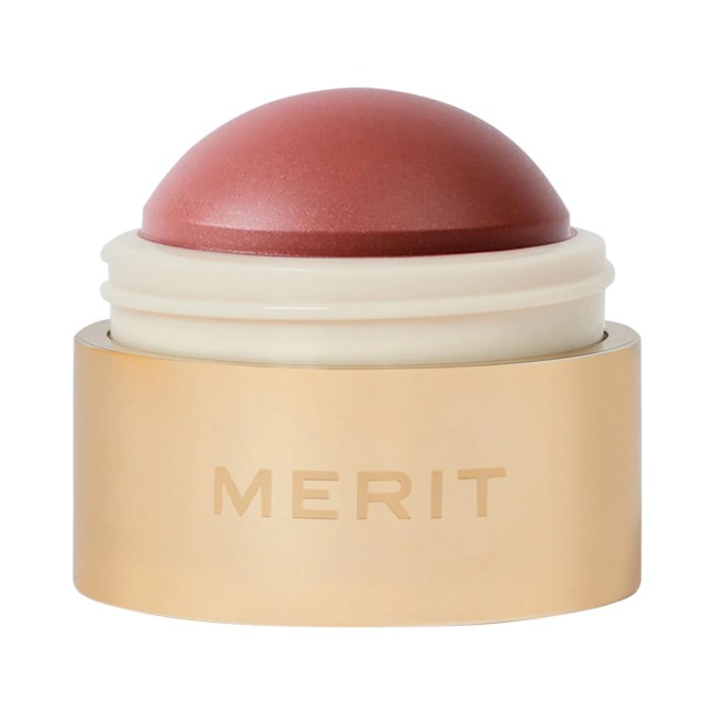 Merit Flush Balm Cream Blush in gold packaging.
