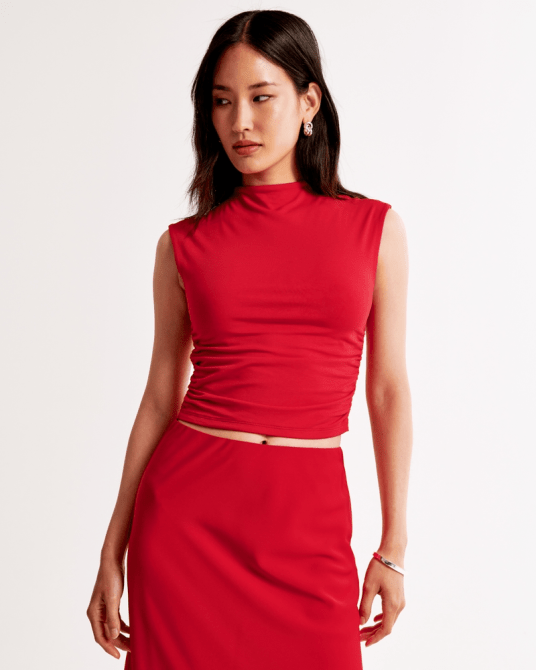 A model wearing the Abercrombie & Fitch Paloma Top in bright red