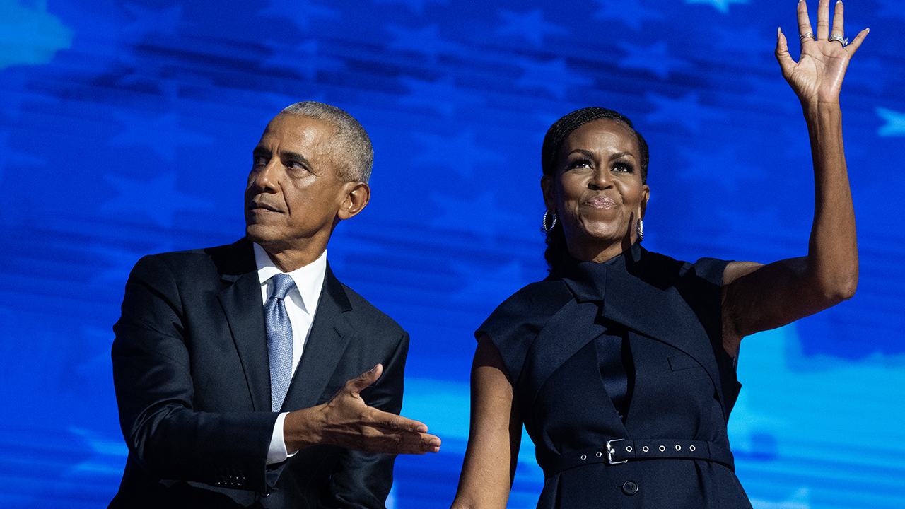 UNITED STATES - AUGUST 20: Former President Barack Obama and former first lady Michelle Obama appear on stage in between their addresses on the second night of the Democratic National Convention at the United Center in Chicago, Ill., on Tuesday, August 20, 2024.