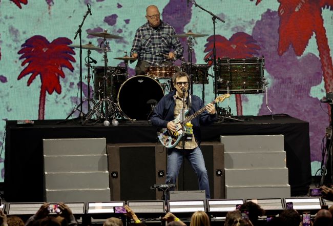 LOS ANGELES, CALIFORNIA - OCTOBER 22: Patrick Wilson and Rivers Cuomo of Weezer perform onstage during Audacy's 9th annual We Can Survive at Hollywood Bowl on October 22, 2022 in Los Angeles, California.