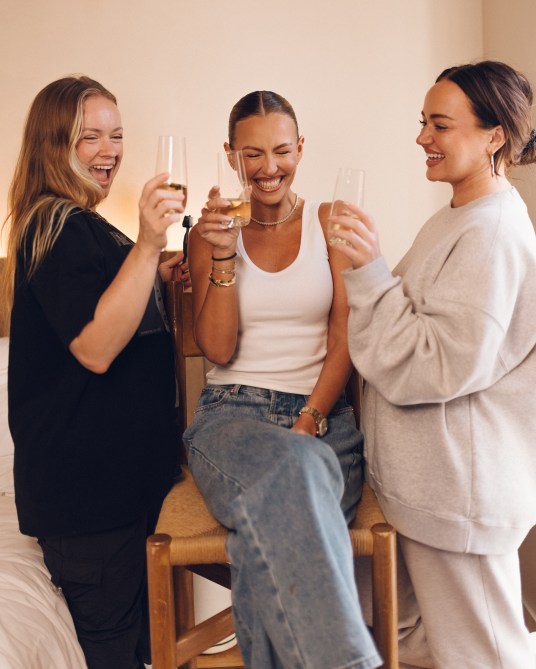 Serena Kerrigan cheers with champagne