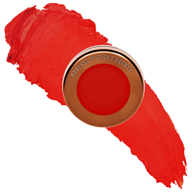 Danessa Myricks Beauty Yummy Skin Blurring Balm Powder in a gold compact.