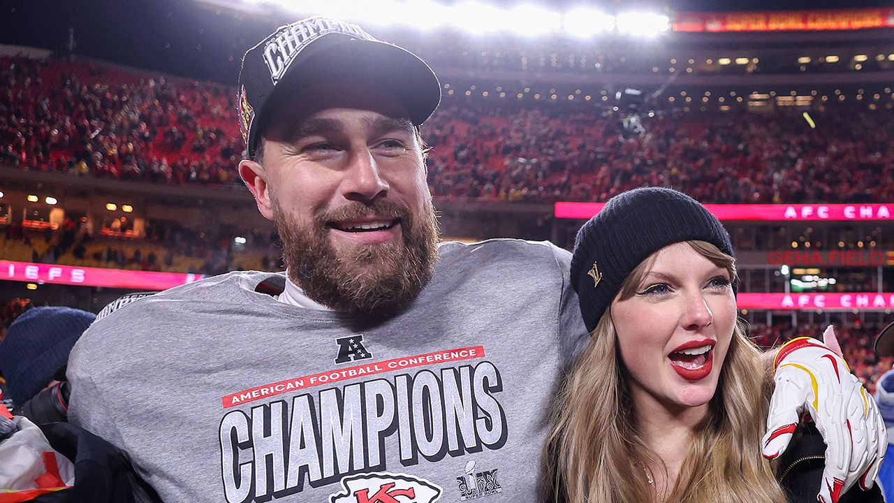 KANSAS CITY, MISSOURI - JANUARY 26: Taylor Swift celebrates with Travis Kelce #87 of the Kansas City Chiefs after defeating the Buffalo Bills 32-29 in the AFC Championship Game at GEHA Field at Arrowhead Stadium on January 26, 2025 in Kansas City, Missouri.